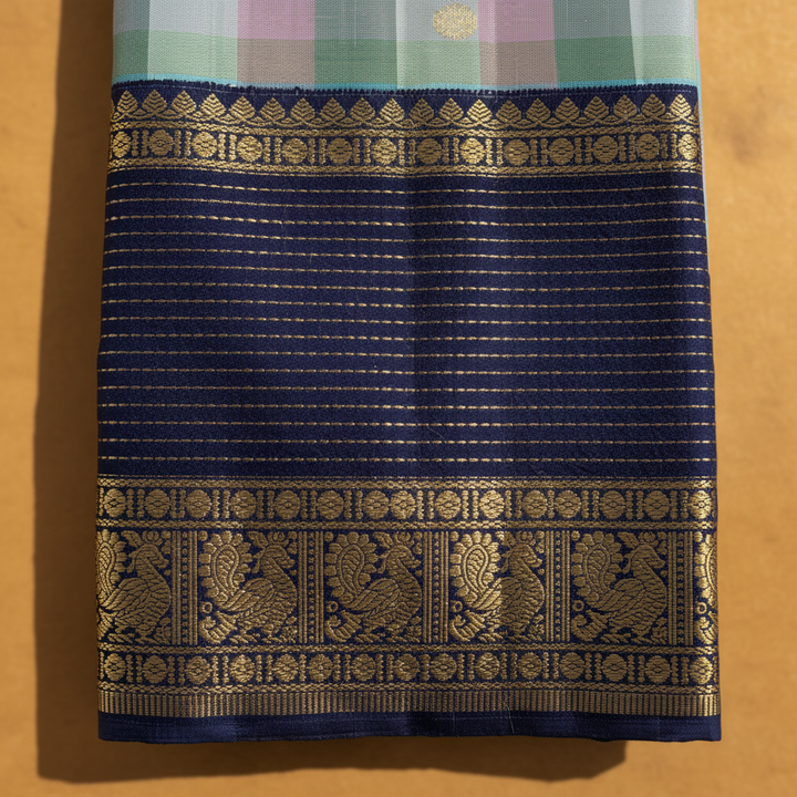 Kuberan Kanchipuram Silk Saree  Sky Blue Multi-Colour Gingham Checks with Scattered Gold Zari Mini Floral Buttas & Broad Midnight Navy Peacock & Temple Arch Border