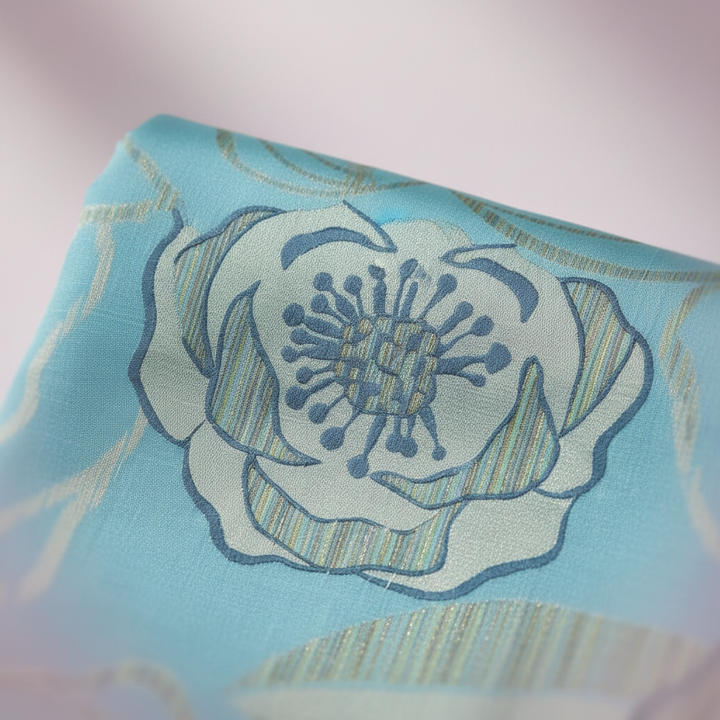 Close-up of floral embroidery and silk texture