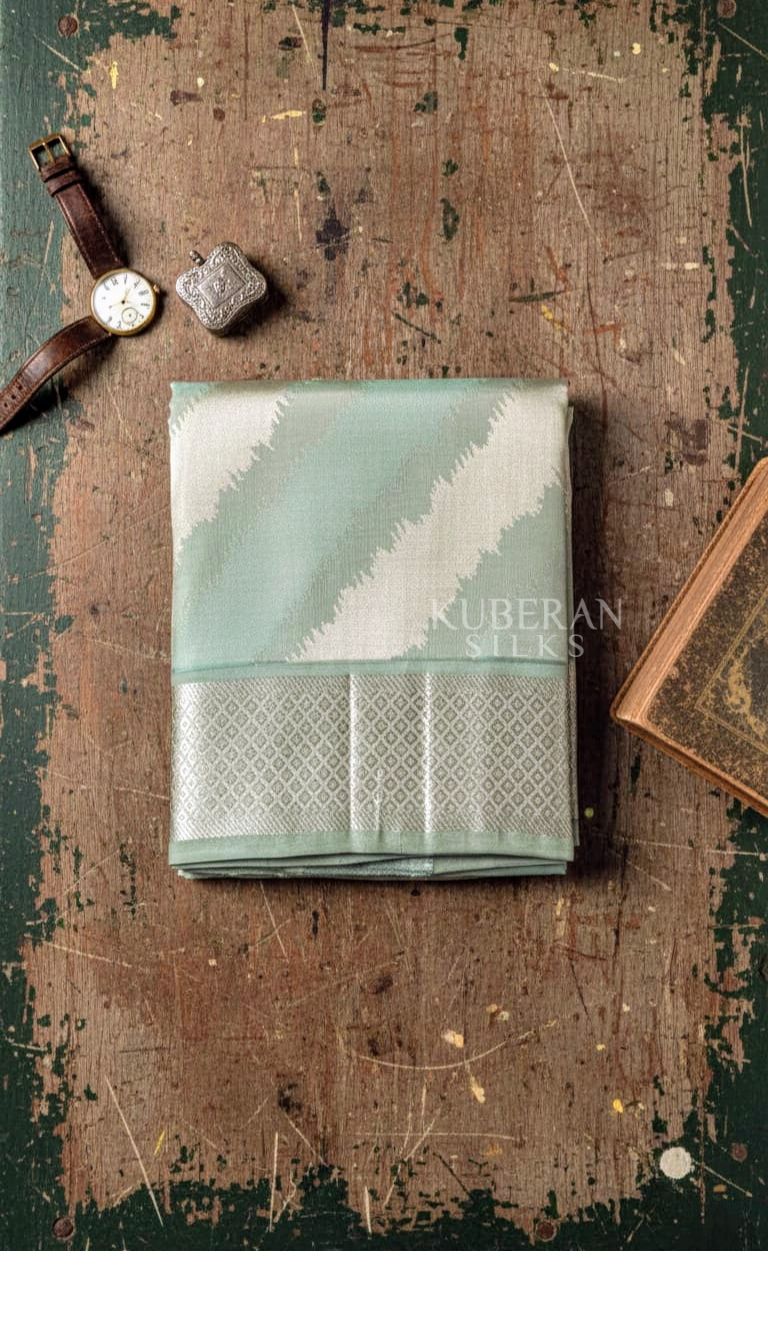 KUBERAN PISTA GREEN AND CREAM COLOUR WITH SILVER BORDER DHOTI