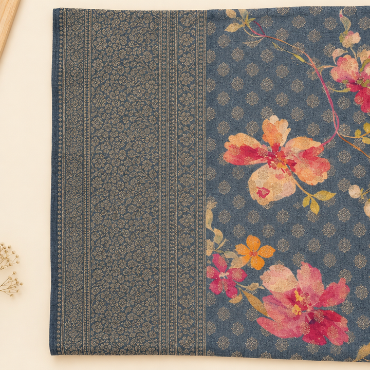 Close-up of patterned woven end panel on aqua blue saree