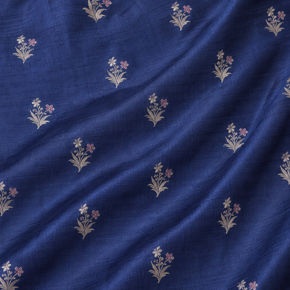 Close-up of the navy blue pure Tussar silk saree body with silver zari floral buttis