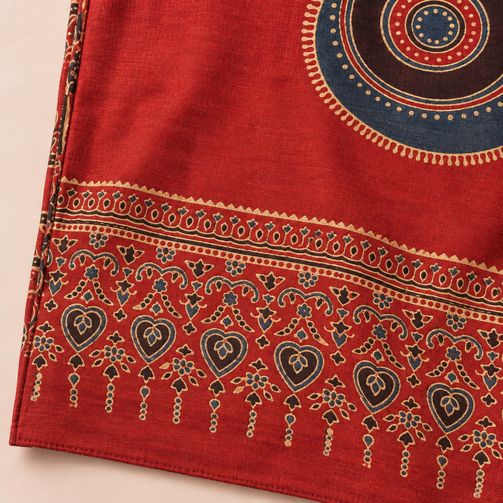 Close-up of red Ajrakh print saree border and fabric details