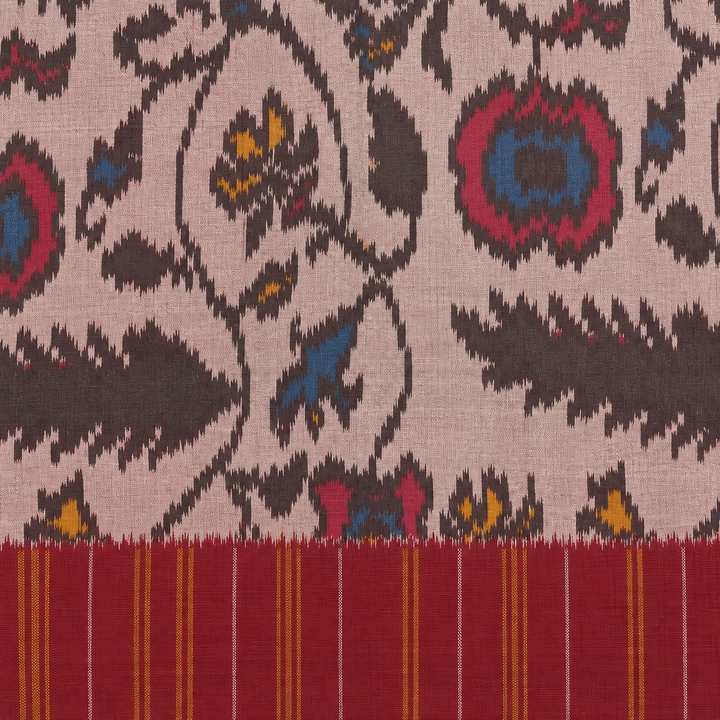 Close-up of maroon pinstripe border and floral ikat body on Pochampally silk saree