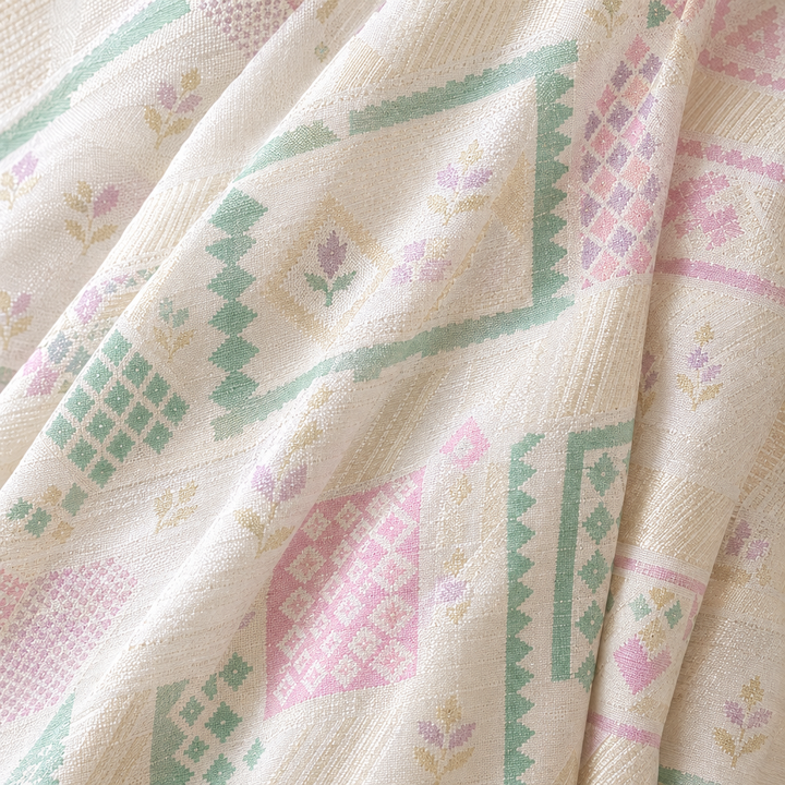 Close-up of the white Banaras georgette saree body with pastel geometric motifs in mint, pink, and lilac