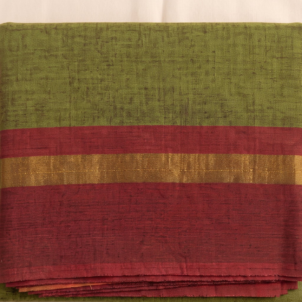 Brick-red border with gold-toned stripe on olive green cotton dance saree, close-up