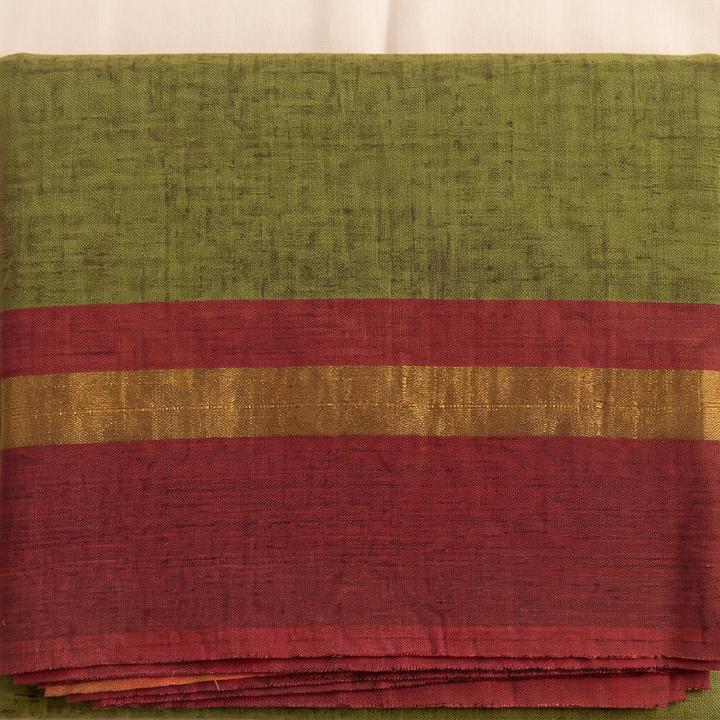 Brick-red border with gold-toned stripe on olive green cotton dance saree, close-up