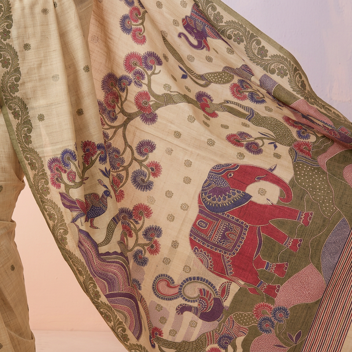 Colourful elephant, bird and branching floral tree illustrations on a pale cream-green saree pallu