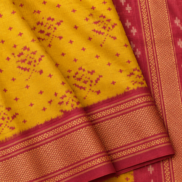 Close-up of yellow and pink Pochampally silk saree texture, contrast pallu and border