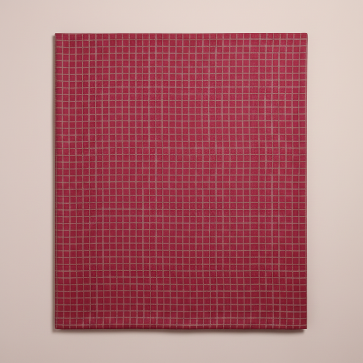 Close-up of the raspberry, rose, and magenta cotton saree with its fine pale-gold checked grid