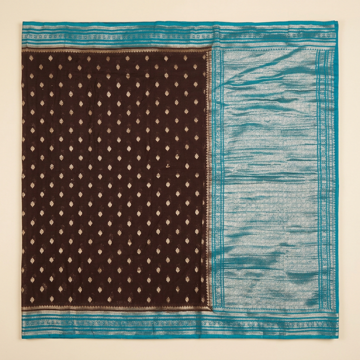 Upright brown and blue Khaddi georgette saree with small gold-toned buta and silver-toned pallu