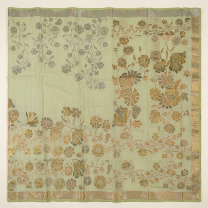 Full straight overhead view of pista green floral vine chiffon saree showing body pallu and borders