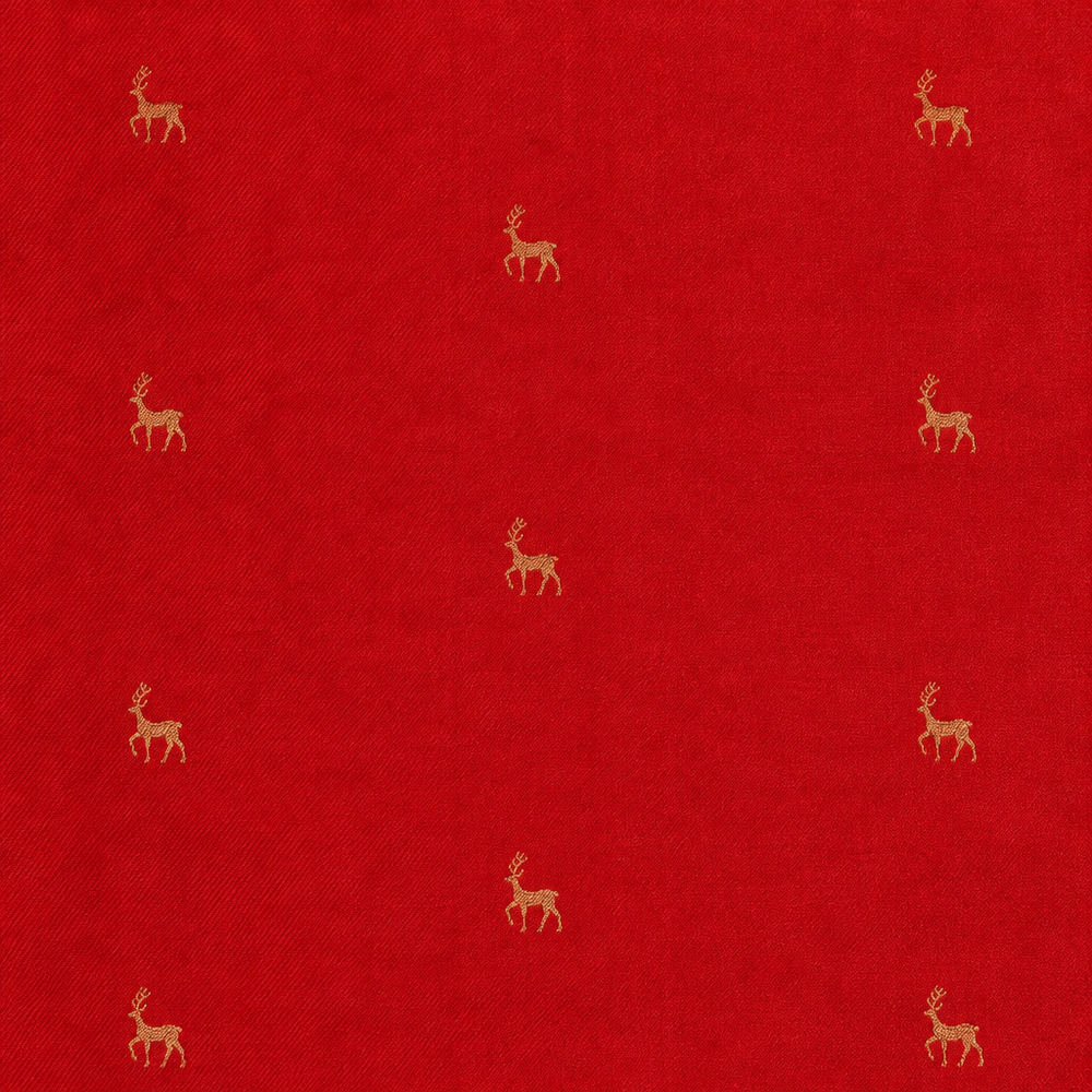 Close-up of red saree body with scattered small gold-toned deer motifs