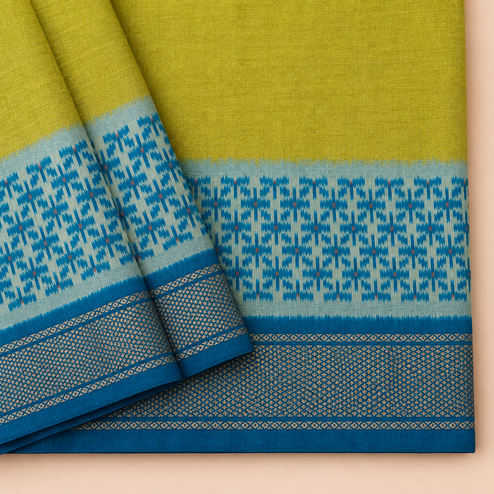 Close-up of parrot green and blue Pochampally silk saree with Ikat checks and border