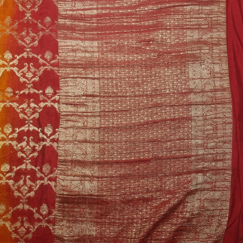 Close-up of red and copper-gold-toned pallu with horizontal woven detailing