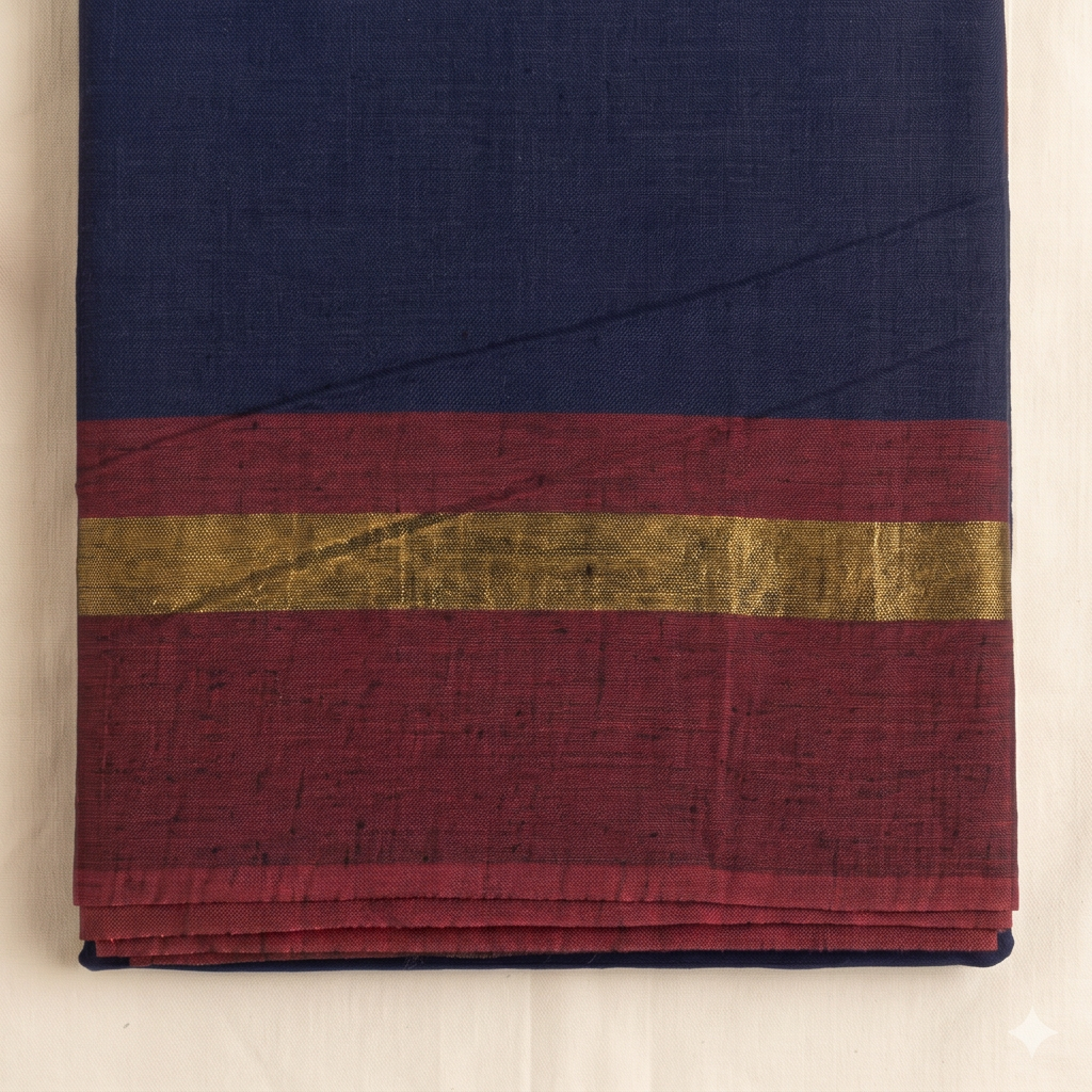 Maroon border with gold-toned stripe on navy blue cotton dance saree, close-up