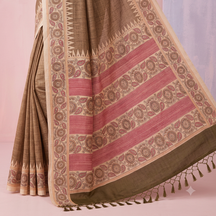 Close-up of dusty rose striped pallu with cream floral motif bands and brown tassels