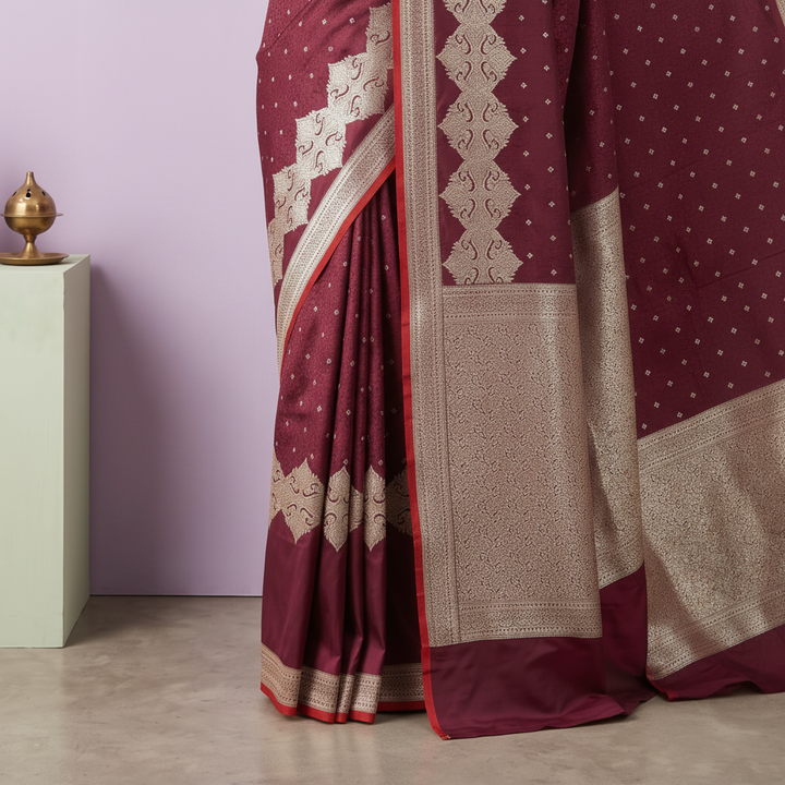 Close-up of the deep maroon Banarasi silk saree silver-beige woven border and pallu panel