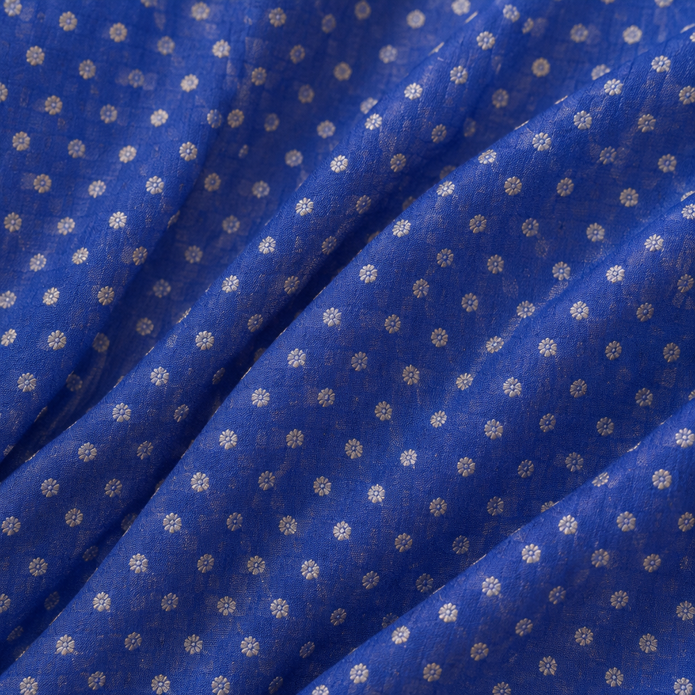 Close-up of the blue Banaras georgette saree body with fine white dotted butti motifs