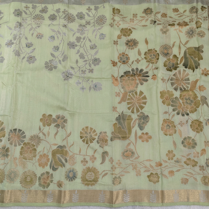 Detail view of multitone floral pallu and champagne gold-toned border with green edging