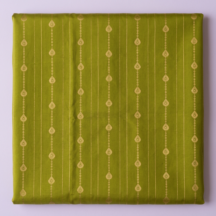 Close-up of the olive-green saree body with fine vertical lines of gold droplet motifs