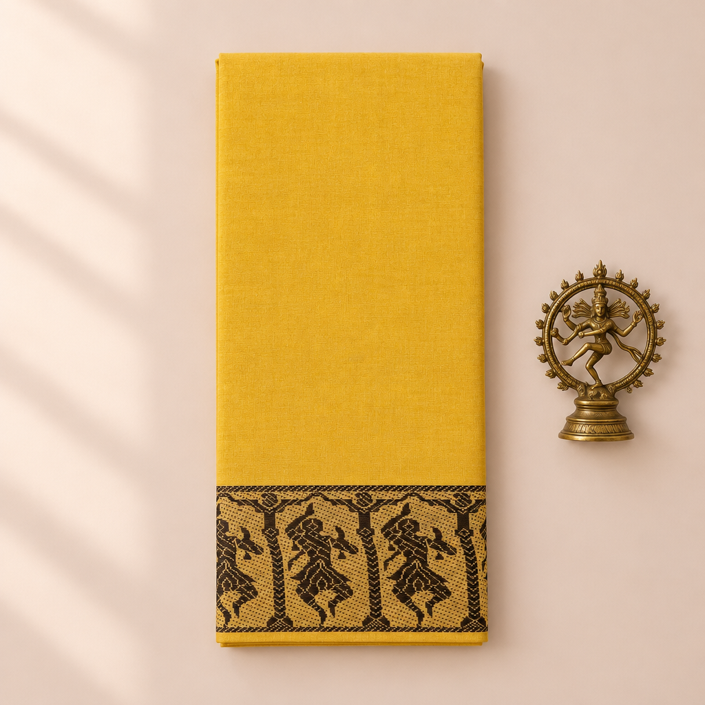 Yellow cotton dance saree with black dancer border, folded flat lay with Nataraja prop