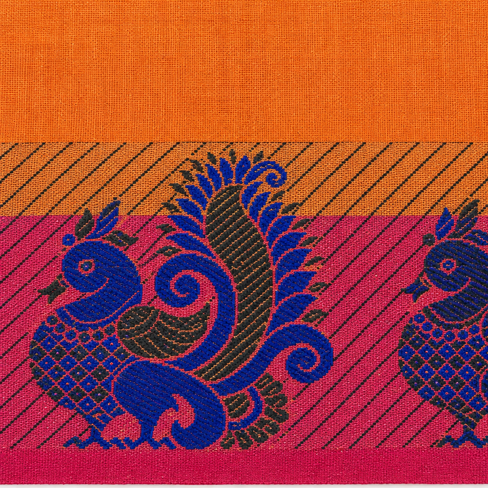 Close-up of royal blue peacock motif on magenta saree border