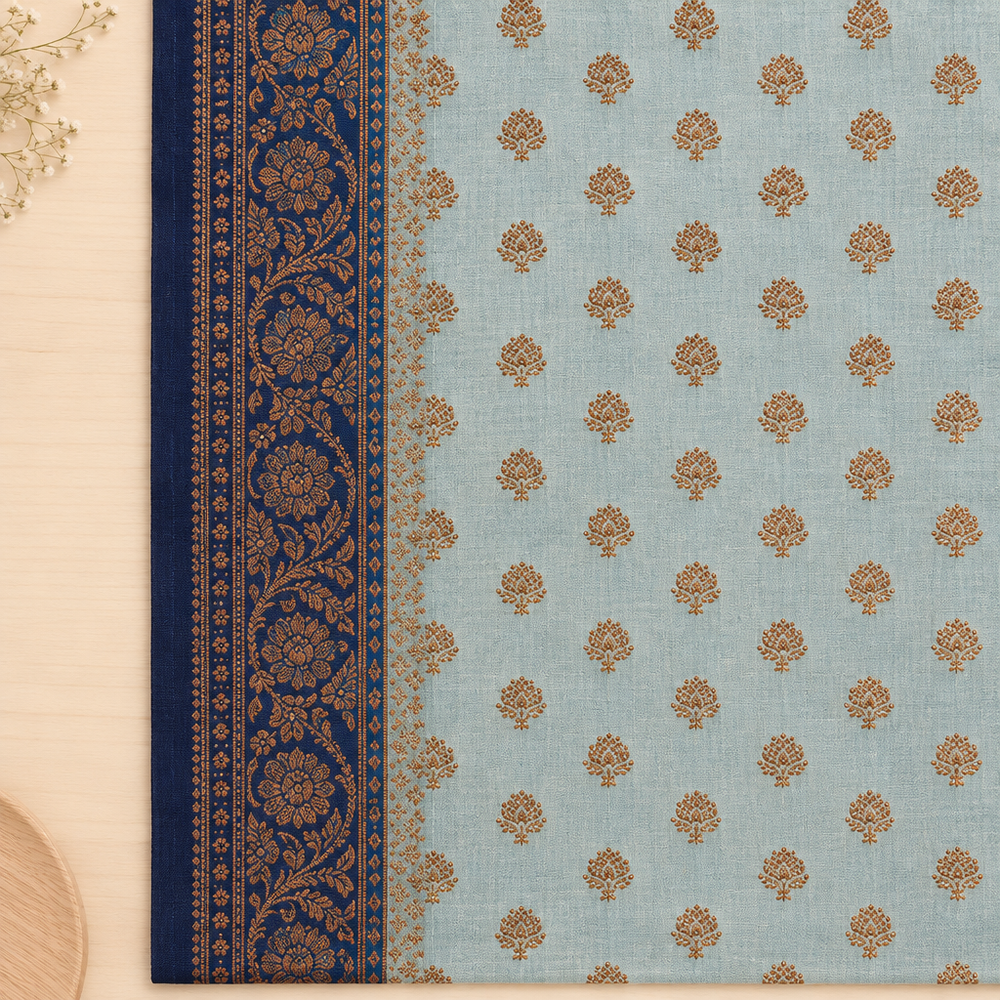 Close-up of ornate navy border on light blue saree