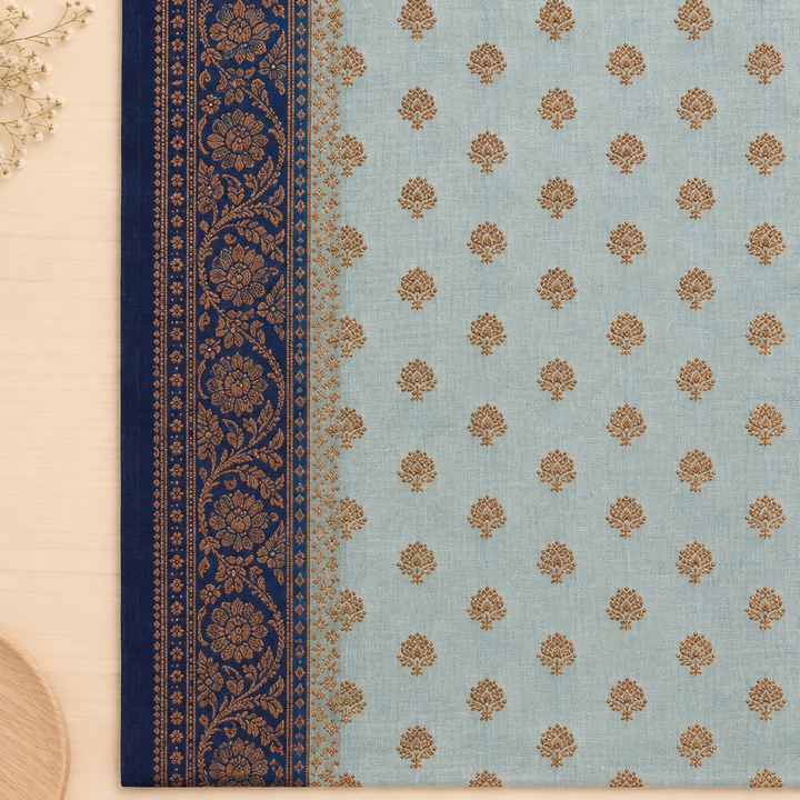 Close-up of ornate navy border on light blue saree