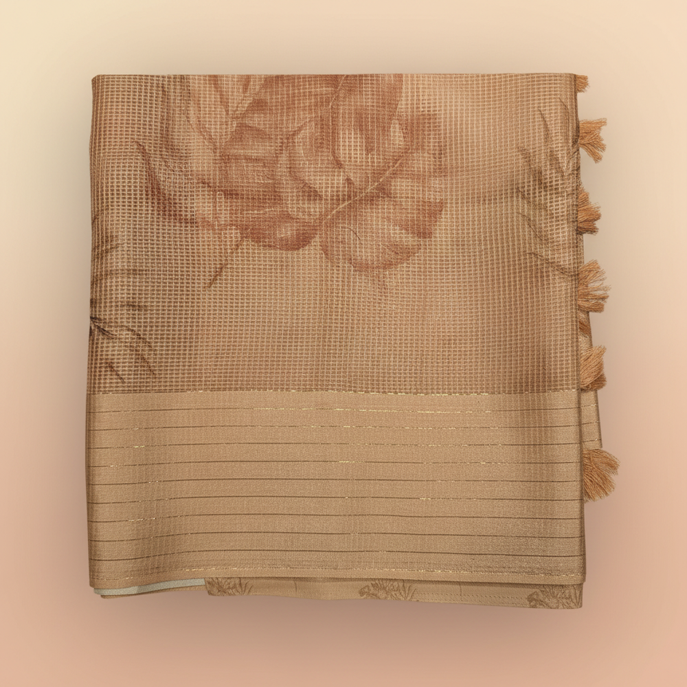 Close-up of the pastel orange Kota cotton saree striped border and tassel pallu