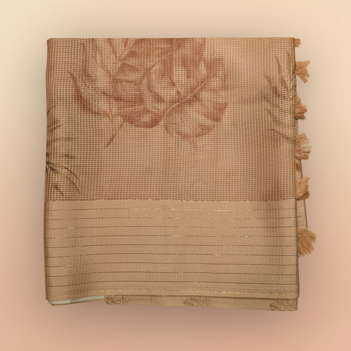 Close-up of the pastel orange Kota cotton saree striped border and tassel pallu
