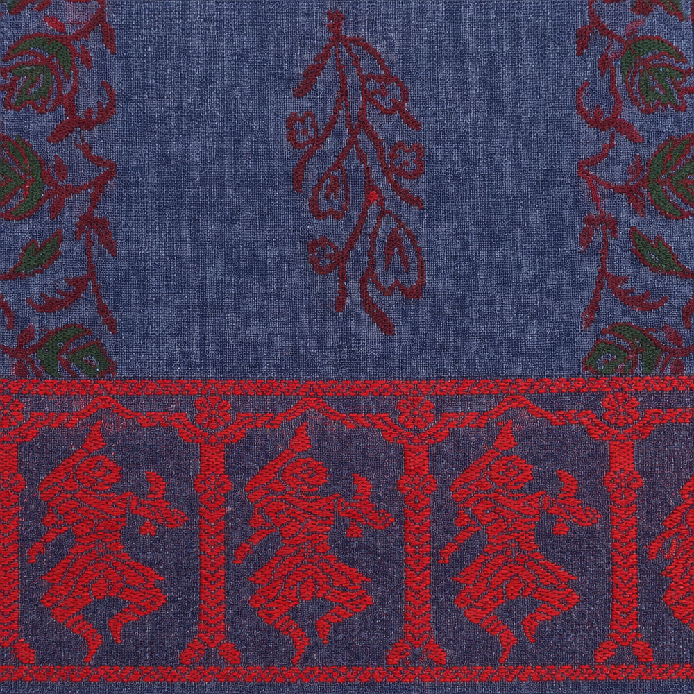 Close-up of red dancer figures on navy border of blue cotton saree