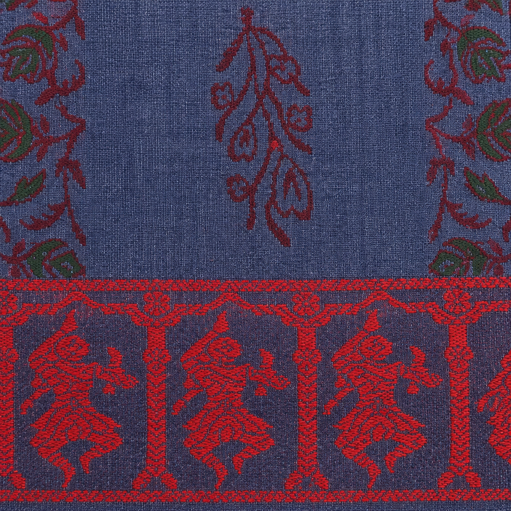 Close-up of red dancer figures on navy border of blue cotton saree