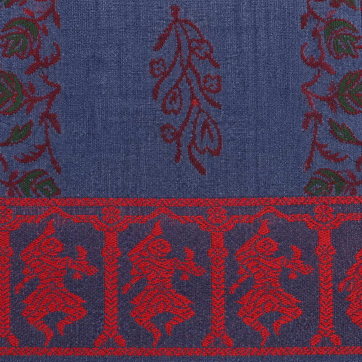 Close-up of red dancer figures on navy border of blue cotton saree
