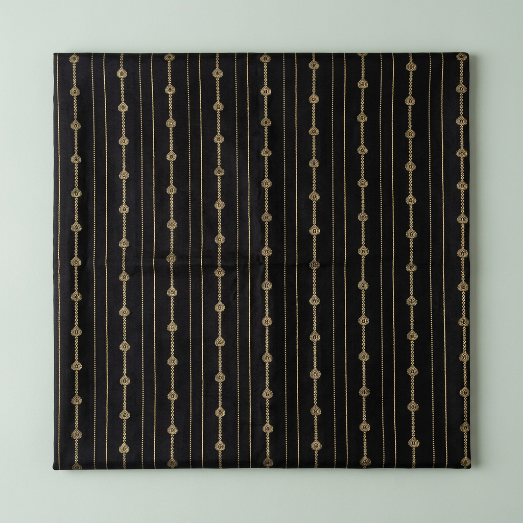 Close-up of the black saree body with fine vertical lines of gold droplet motifs