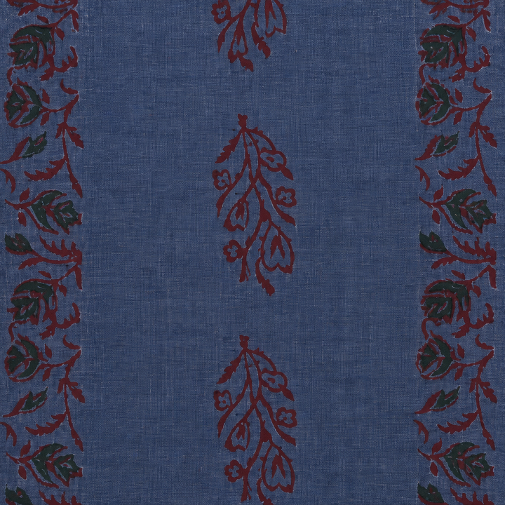 Close-up of maroon floral vine print on blue cotton saree body