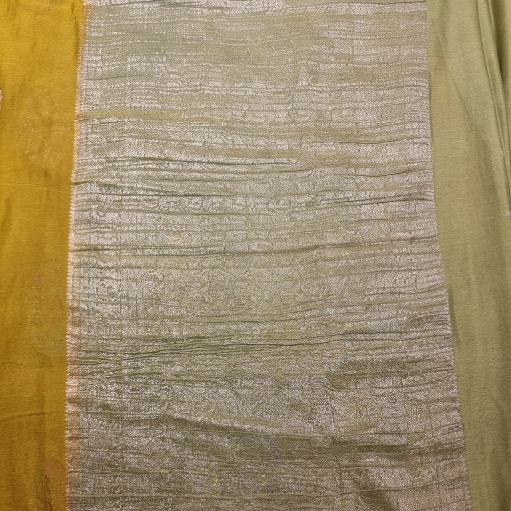 Close-up of pale green metallic pallu with fine horizontal woven detailing