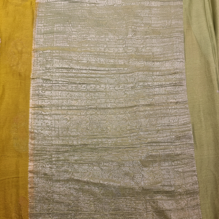 Close-up of pale green metallic pallu with fine horizontal woven detailing