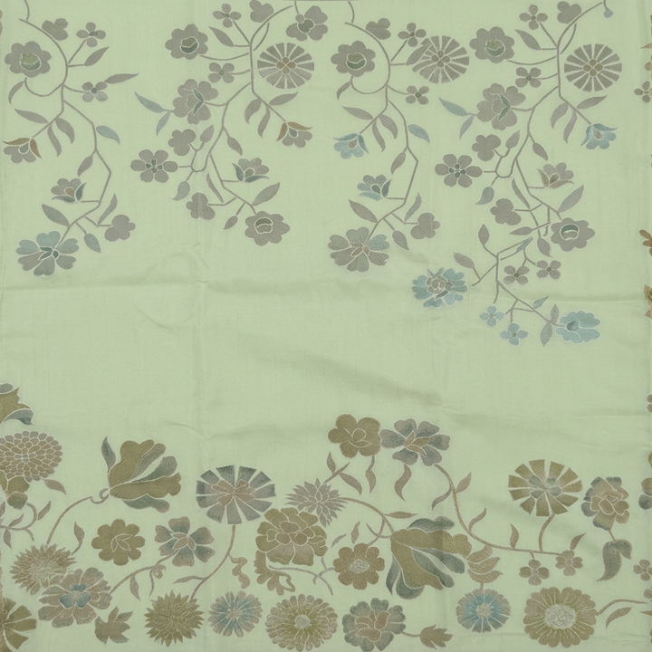 Detail view of grey-sage floral vines and larger multitone flowers on pista green chiffon
