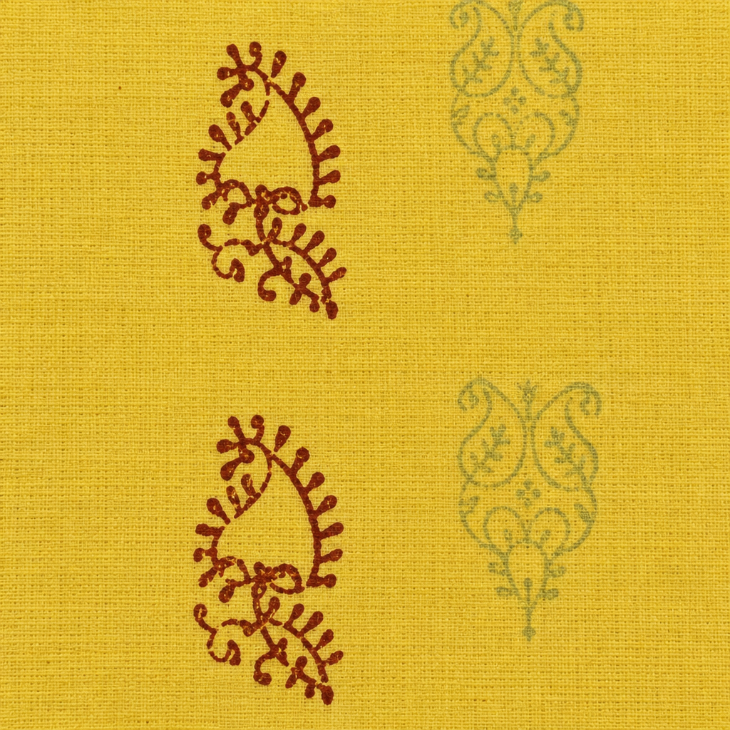 Close-up of rust paisley buta on lemon yellow cotton saree body