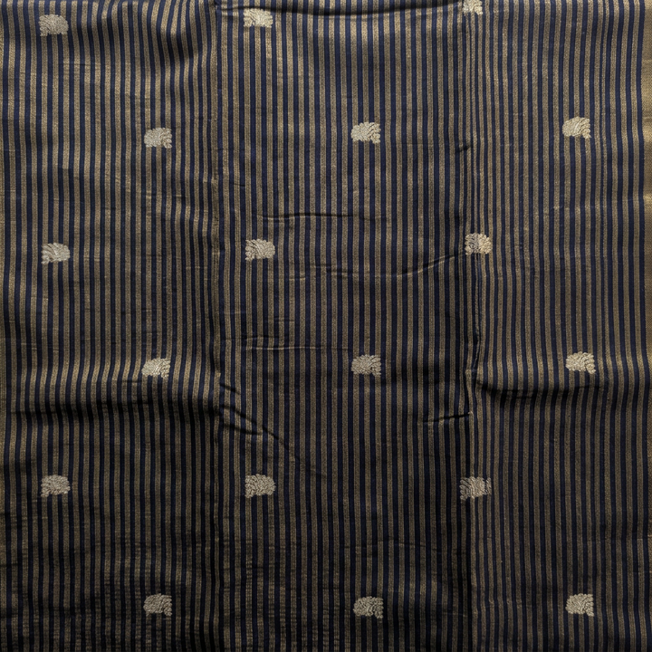 Close-up of navy-blue saree body with fine gold-toned stripes and small butta motifs