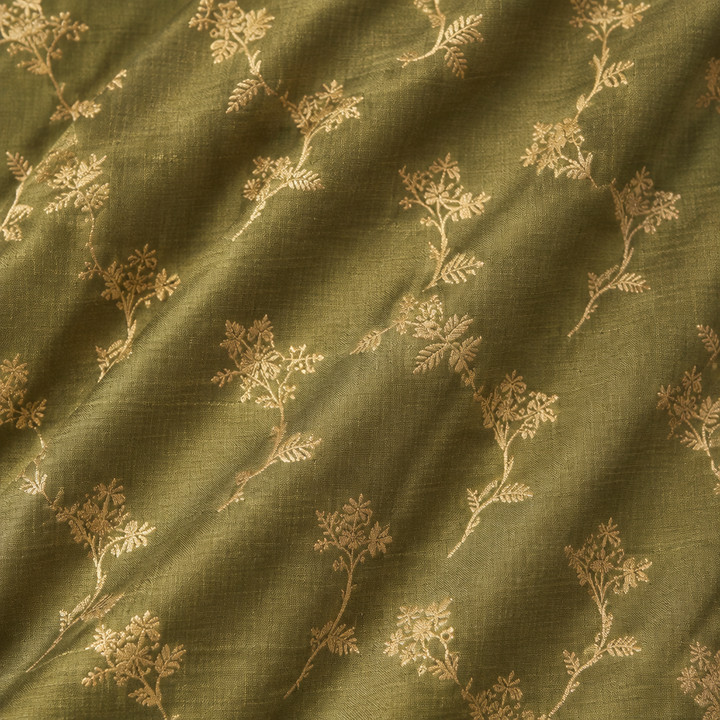 Close-up of the green pure Tussar silk saree body with gold zari floral motifs
