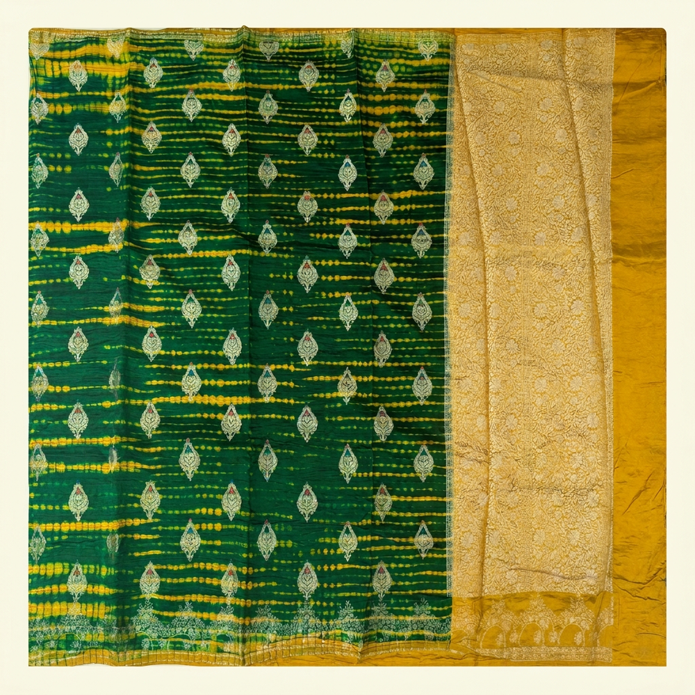 Full straight view of green and yellow Shibori silk saree with leaf motifs and gold-toned floral pallu