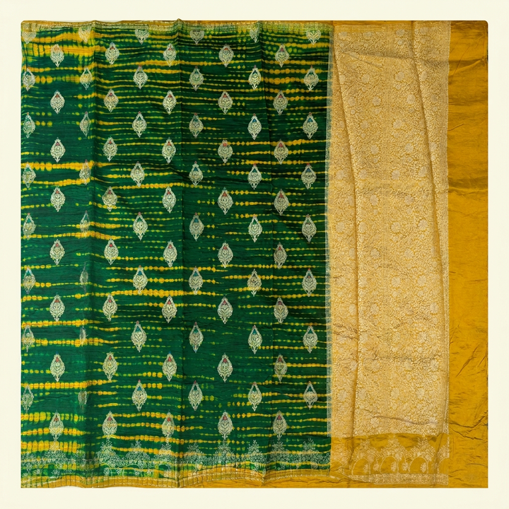 Full straight view of green and yellow Shibori silk saree with leaf motifs and gold-toned floral pallu
