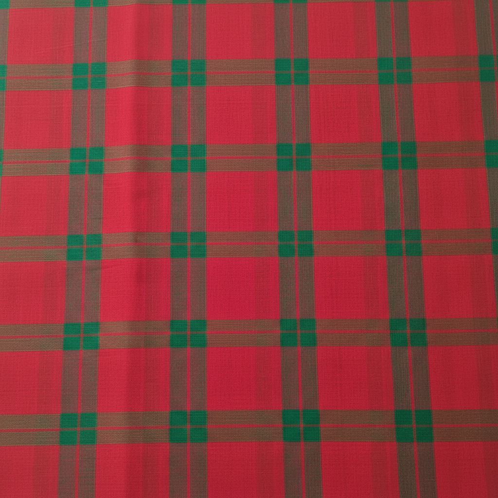 Close-up of the pink and crimson cotton saree showing its dark olive and emerald-green checked plaid grid