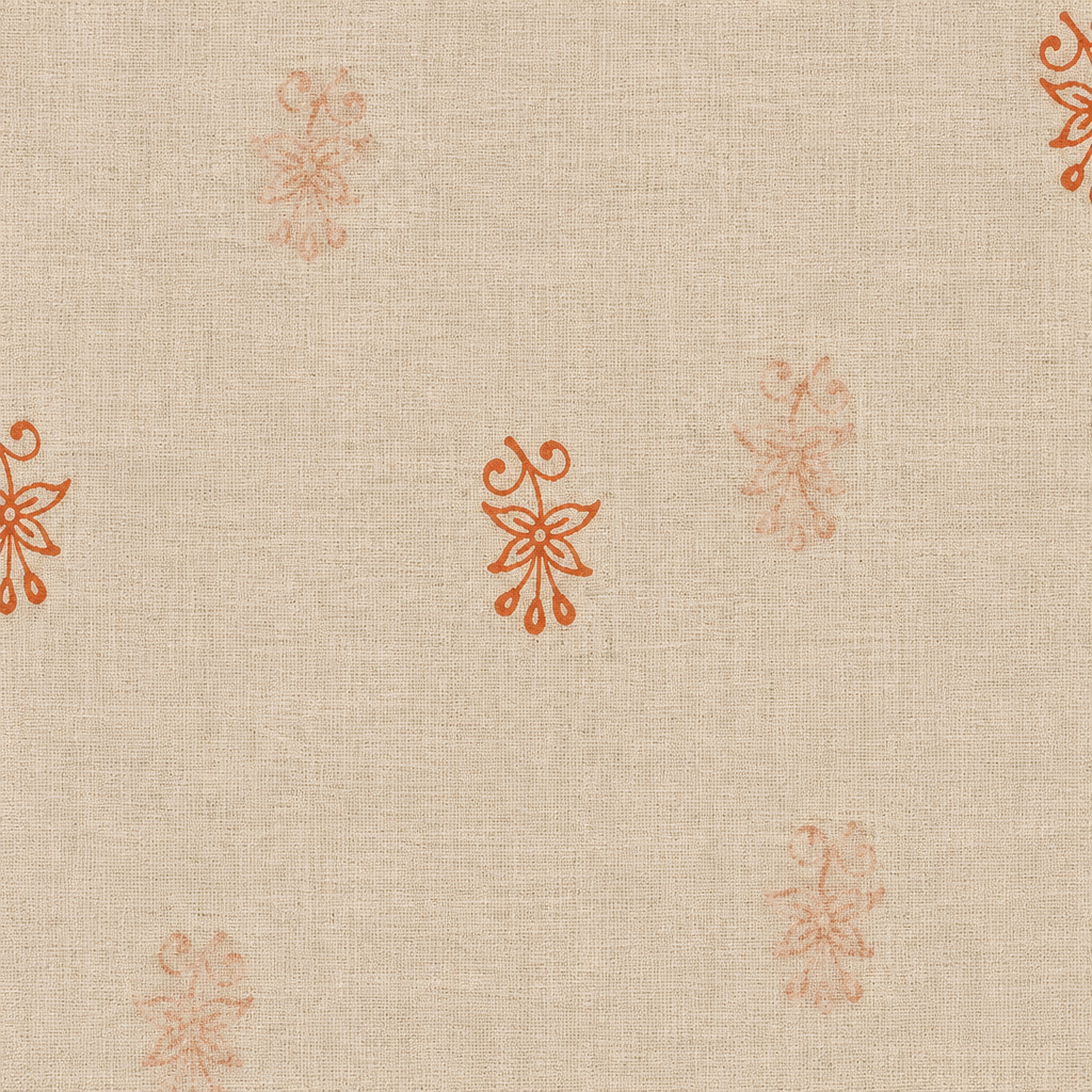 Close-up of orange floral buta on cream cotton saree body