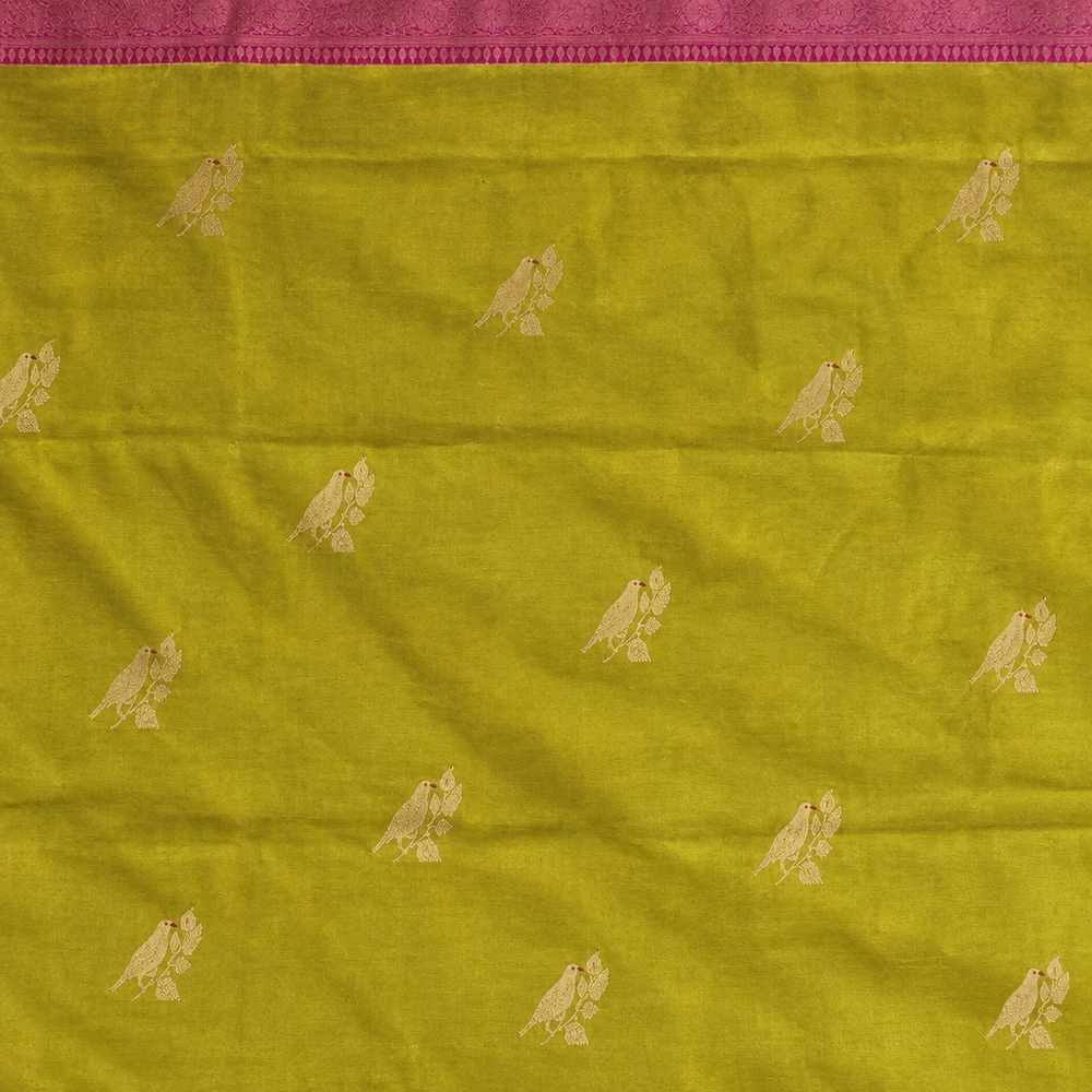 Yellow-green saree body detail with small pale bird motifs