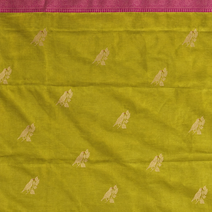 Yellow-green saree body detail with small pale bird motifs