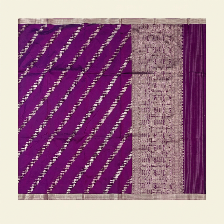 Full straight view of purple Banarasi silk saree with diagonal metallic-toned motifs patterned pallu and narrow borders