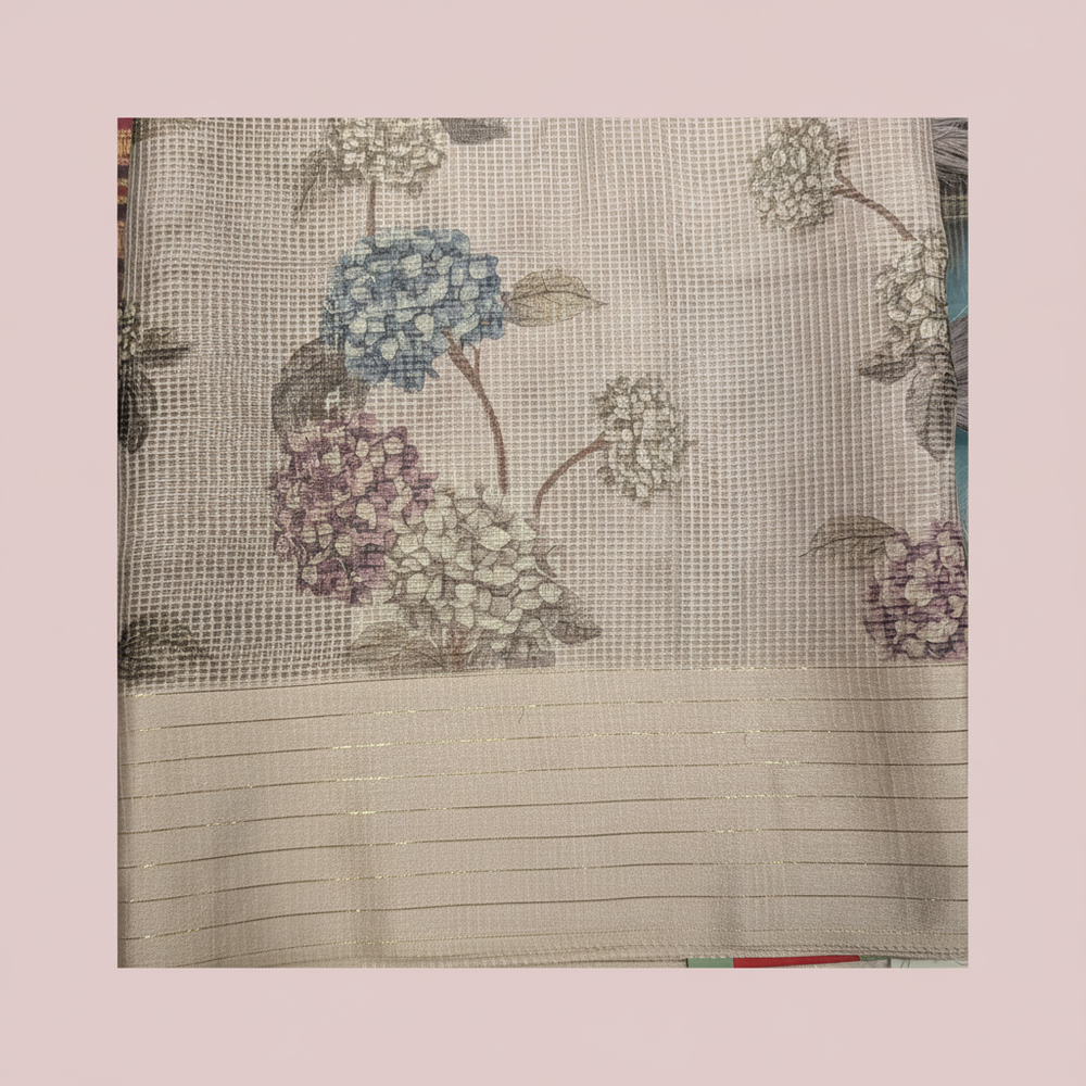 Close-up of the pastel pink Kota cotton saree border and floral pallu