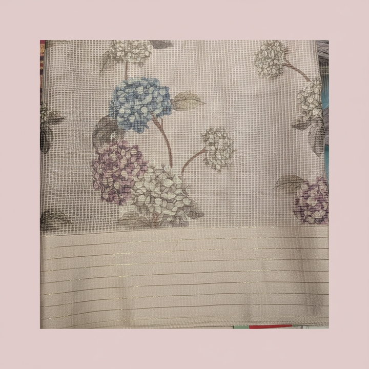 Close-up of the pastel pink Kota cotton saree border and floral pallu